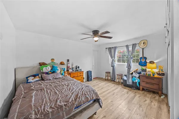 a bedroom with a bed and closet