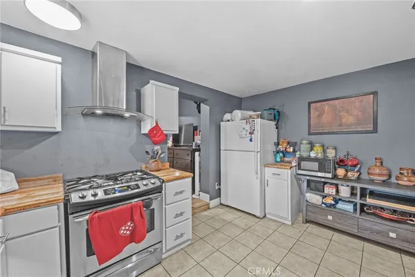 a bedroom with furniture and a flat screen tv