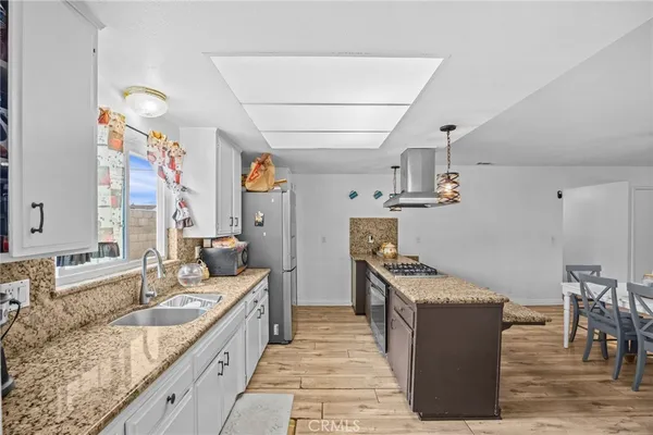 a kitchen with sink and stove