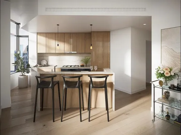 a kitchen with a table chairs stove and cabinets