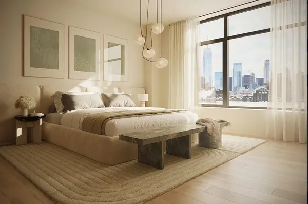 a bedroom with a large bed and a window