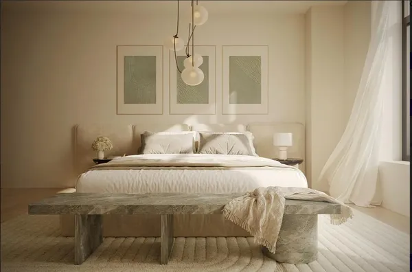 a bedroom with a bed and chandelier