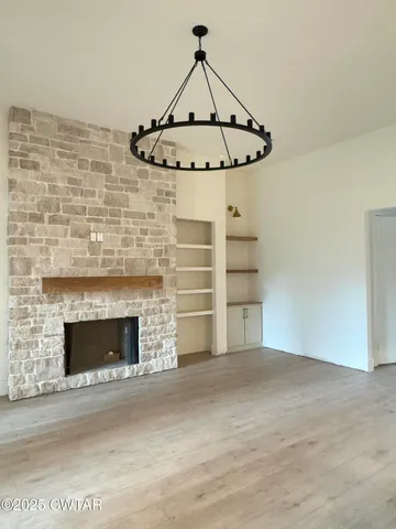 a view of a fireplace with wooden floor