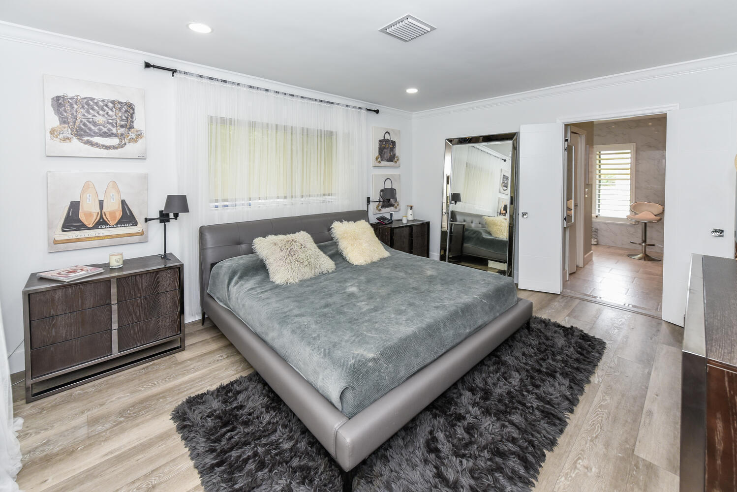 880 Hickory Terrace Boca Raton, FL 33486 - Photo 18 of 38 a living room with a couch and a dresser
