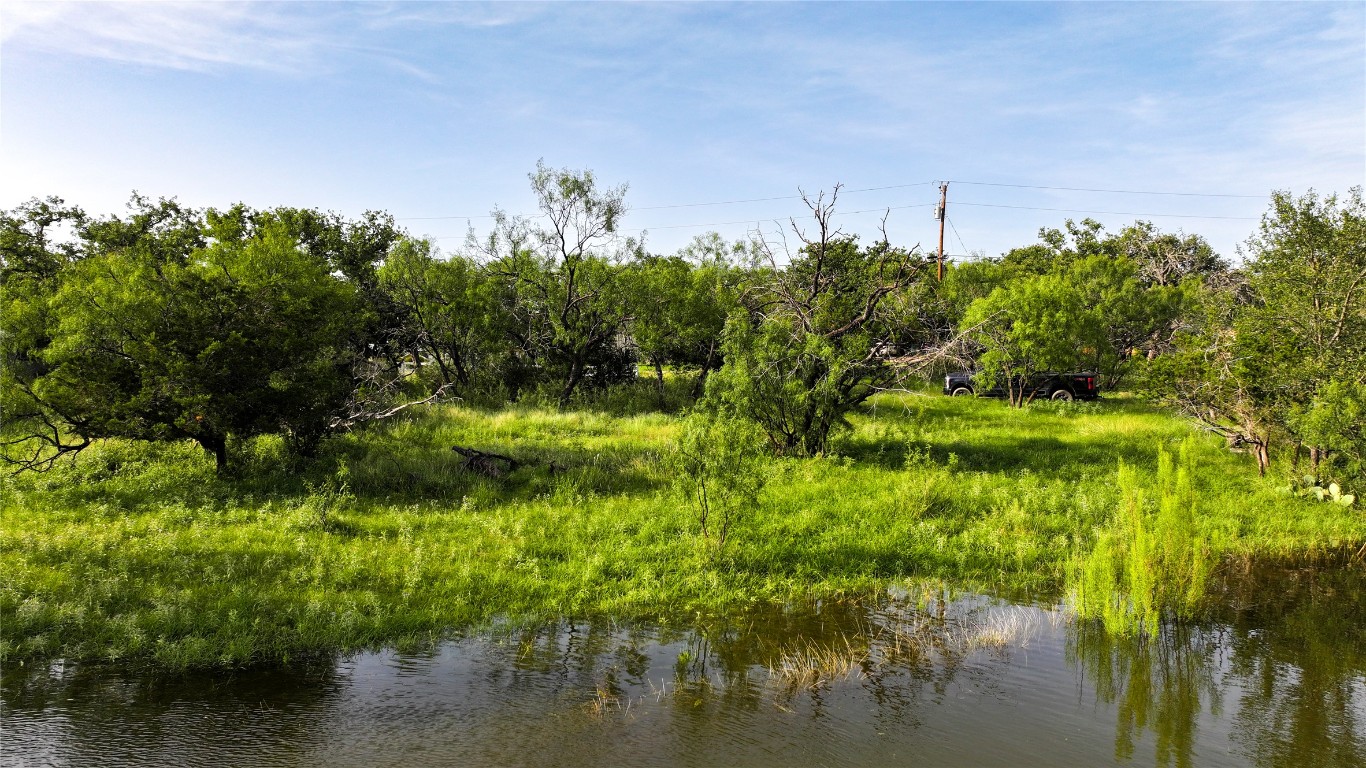 304 North Chaparral Burnet, TX 78611 - Photo 1 of 24 a view of a lake with a house in the background