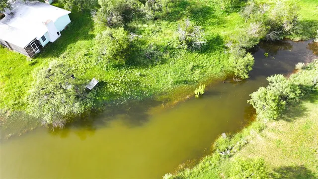 a view of a lake with a yard