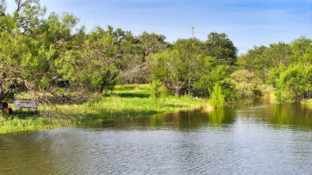a view of lake with green space