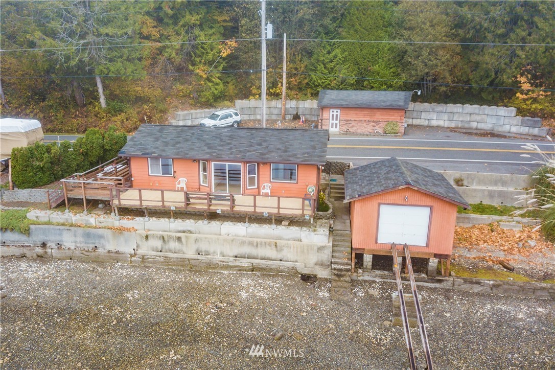 7971 Northeast North Shore Road Belfair, WA 98528 - Photo 1 of 25 a house view with a garden space