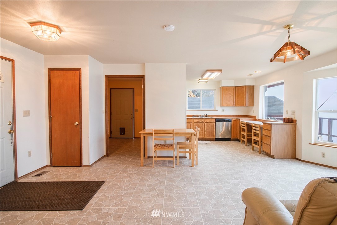 7971 Northeast North Shore Road Belfair, WA 98528 - Photo 11 of 25 a living room with furniture and kitchen view