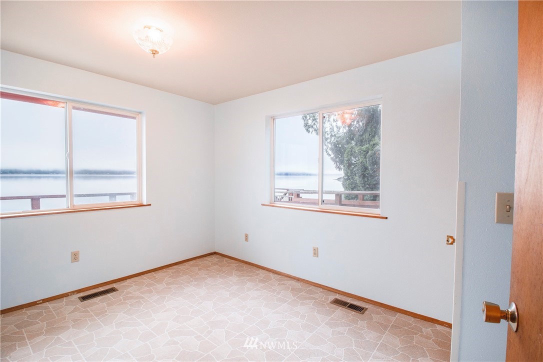 7971 Northeast North Shore Road Belfair, WA 98528 - Photo 14 of 25 an empty room with windows