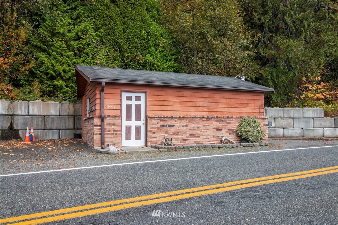 7971 Northeast North Shore Road Belfair, WA 98528 - Photo 3 of 25 a view of a house with a street