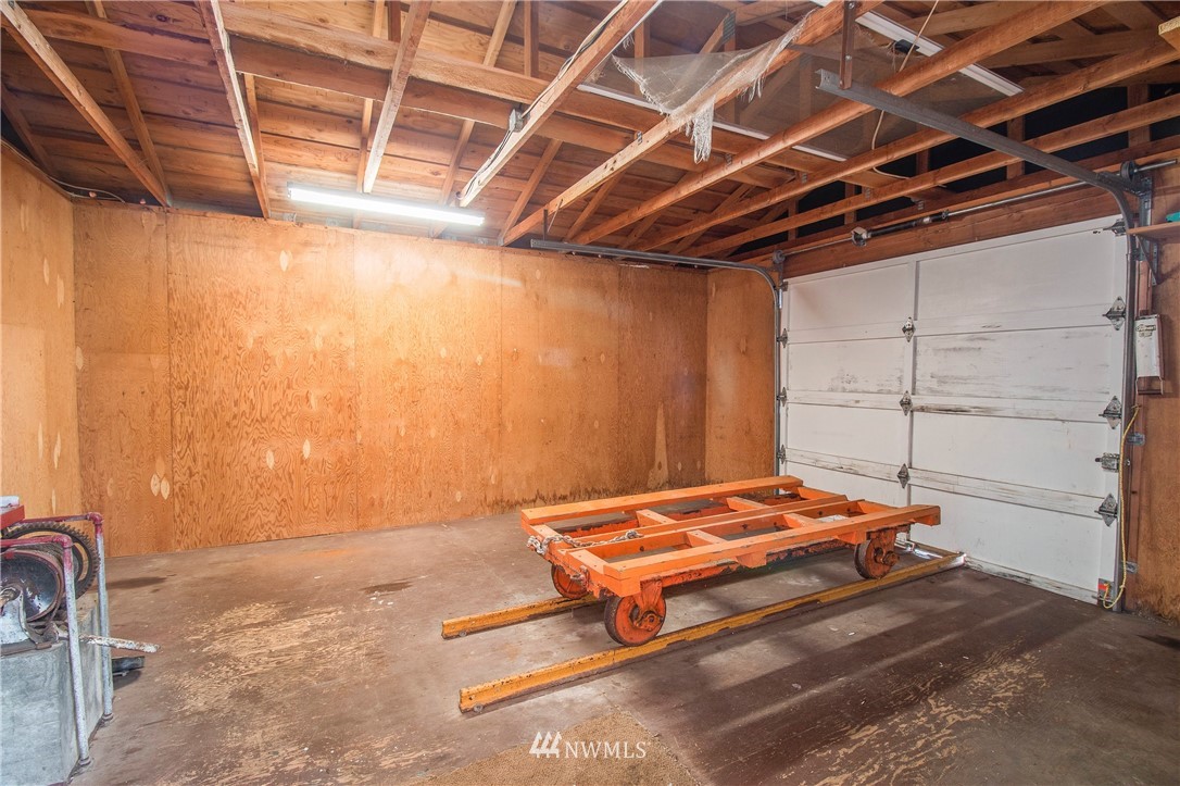 7971 Northeast North Shore Road Belfair, WA 98528 - Photo 22 of 25 a bedroom with a bed and a window