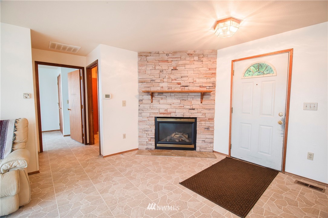 7971 Northeast North Shore Road Belfair, WA 98528 - Photo 6 of 25 a view of a livingroom with a fireplace