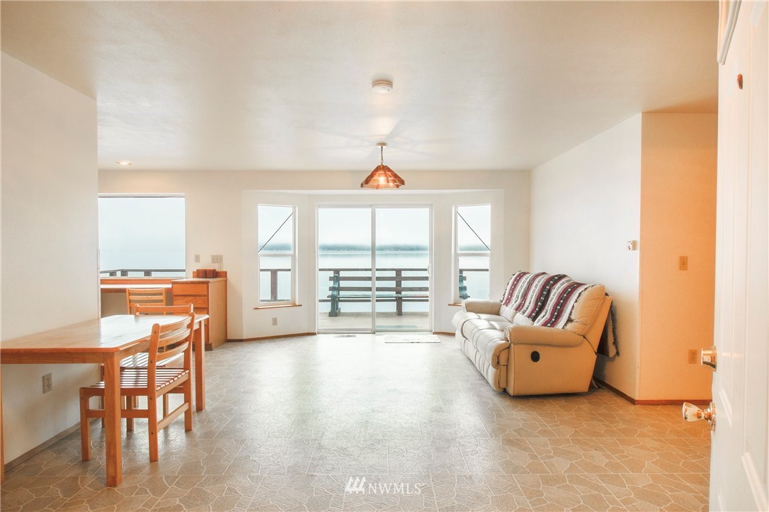 7971 Northeast North Shore Road Belfair, WA 98528 - Photo 10 of 25 a living room with furniture and a window