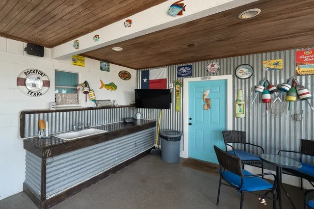 a view of a backyard with seating space