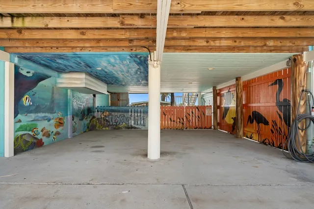 a view of a chairs and table in the back yard of the house