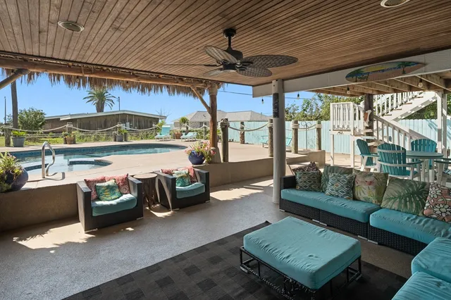 a view of a balcony with wooden floor and fence