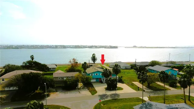 an aerial view of a house with outdoor space