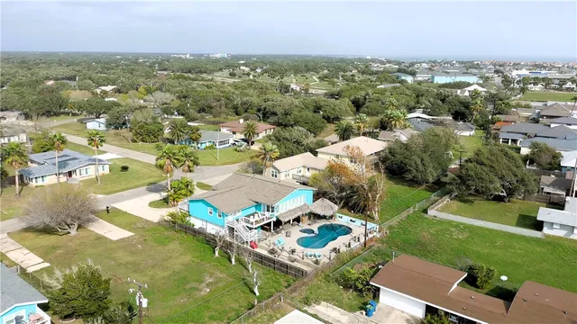 an aerial view of a house with a lake view