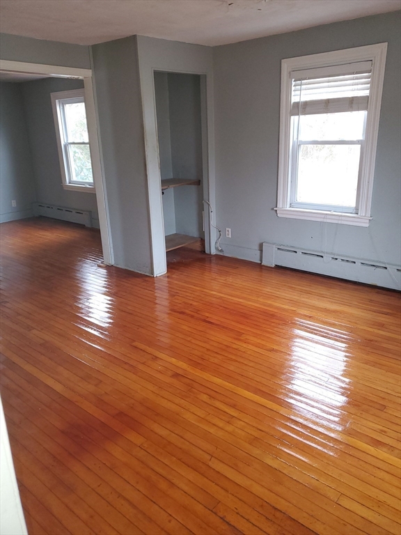 36 Wallace Road Sturbridge, MA 01566 - Photo 7 of 18 an empty room with wooden floor and windows
