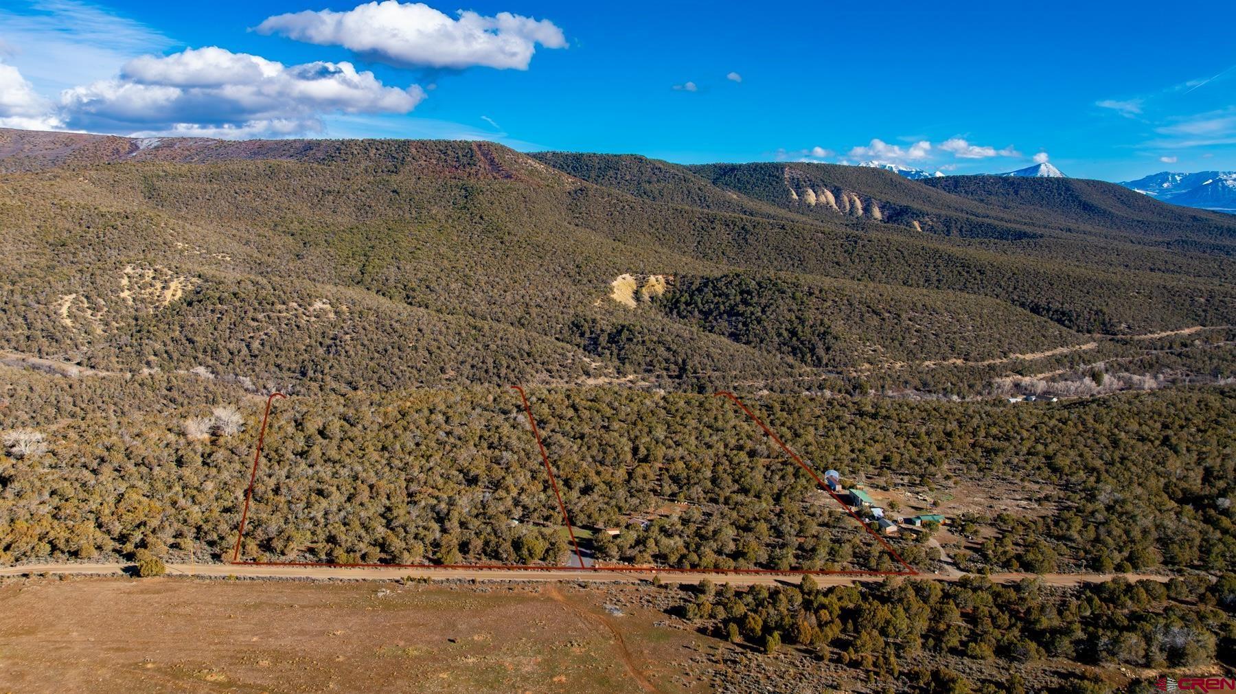 15444 3050th Road Hotchkiss, CO 81419 - Photo 15 of 18 a view of a yard next to a building