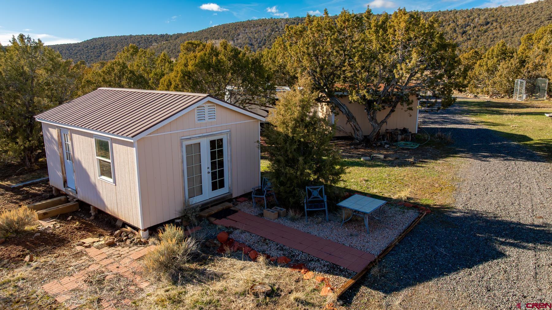 15444 3050th Road Hotchkiss, CO 81419 - Photo 6 of 18 a view of a couches in backyard of the house