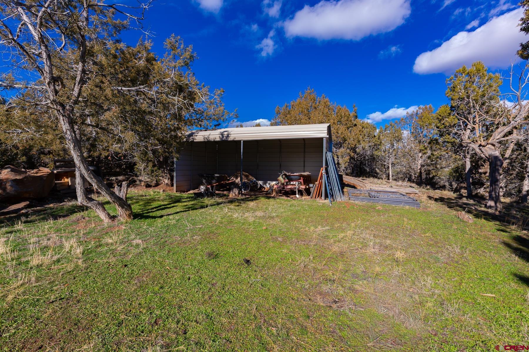 15444 3050th Road Hotchkiss, CO 81419 - Photo 7 of 18 a view of a slide in back of a house
