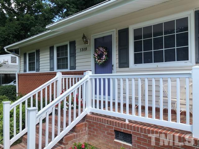 1309 Kelly Road Garner, NC 27529 - Photo 3 of 19 a balcony view with a garden