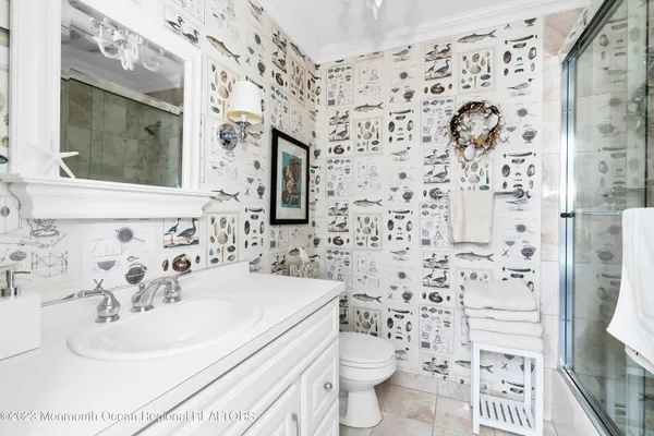 a bedroom with a bed and a chair