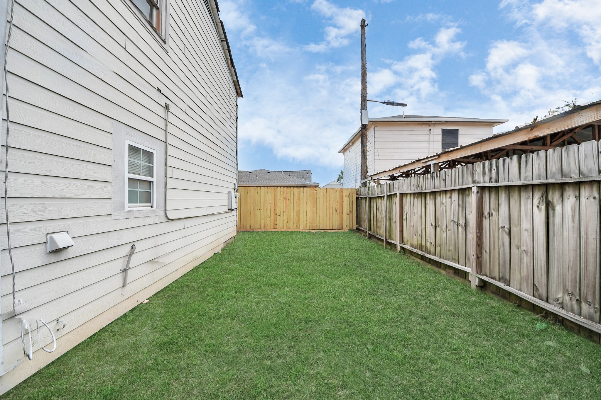 2902 Truxillo Street Houston, TX 77004 - Photo 32 of 32 a view of a backyard with wooden fence