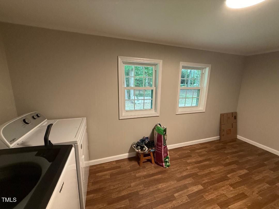 1196 Cash Road Creedmoor, NC 27522 - Photo 14 of 16 a view of a workspace with furniture and a window