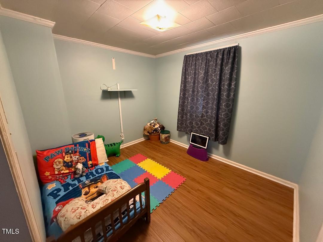 1196 Cash Road Creedmoor, NC 27522 - Photo 6 of 16 a living room with furniture and a wooden floor