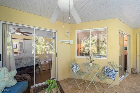 a bedroom with a bed and glass door