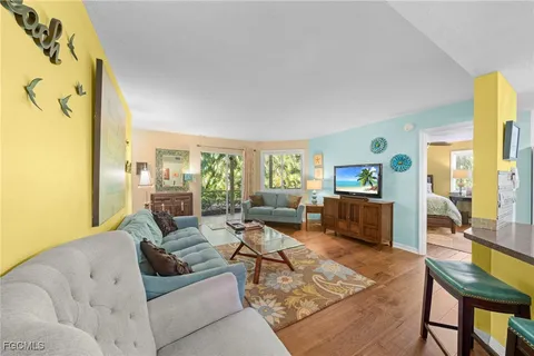 a living room with furniture and a table