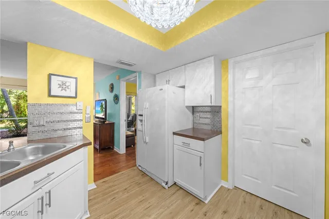 a kitchen with a refrigerator and countertop
