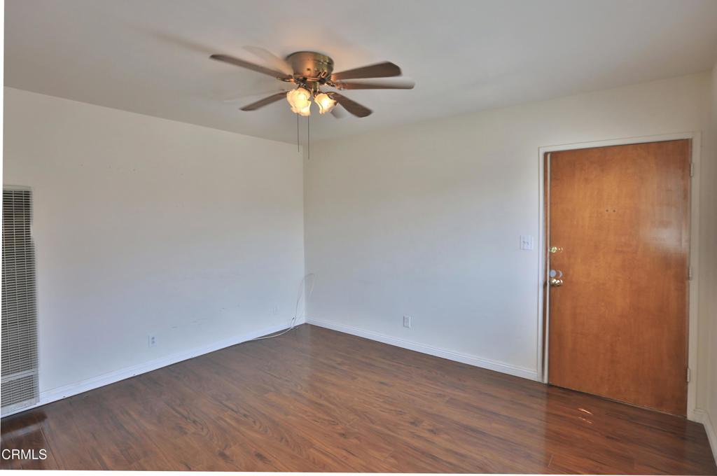 124 South Olive Avenue, Unit B Alhambra, CA 91801 - Photo 2 of 12 a view of a room with wooden floor closet and a ceiling fan