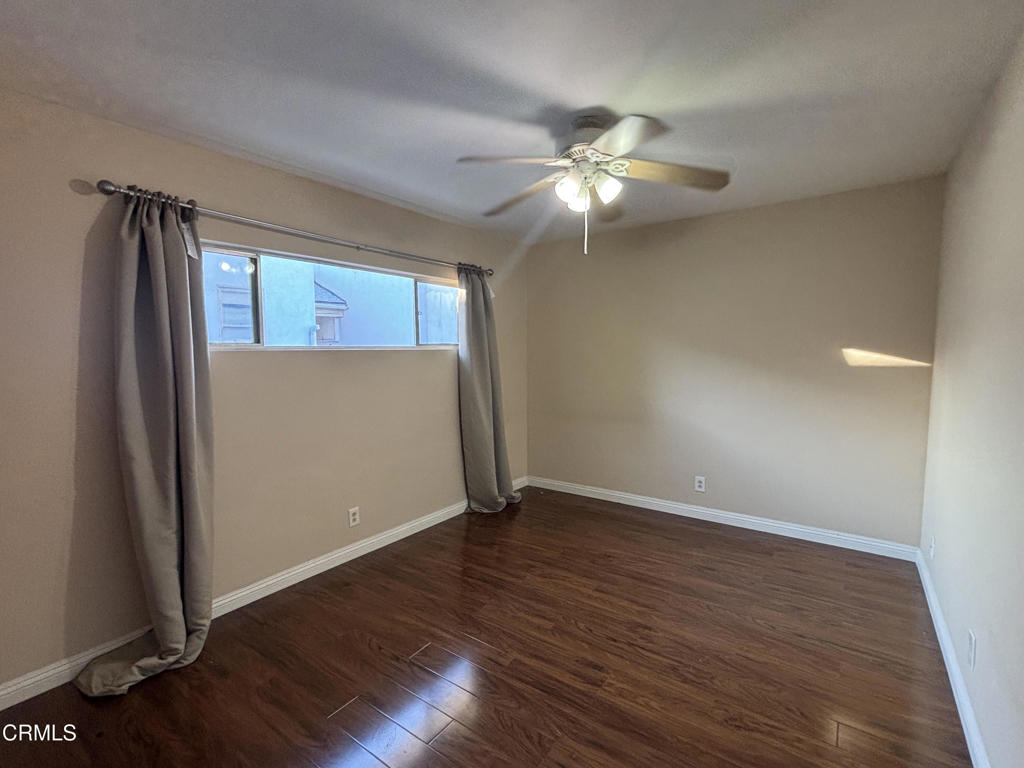 124 South Olive Avenue, Unit B Alhambra, CA 91801 - Photo 7 of 12 an empty room with wooden floor cabinet and windows