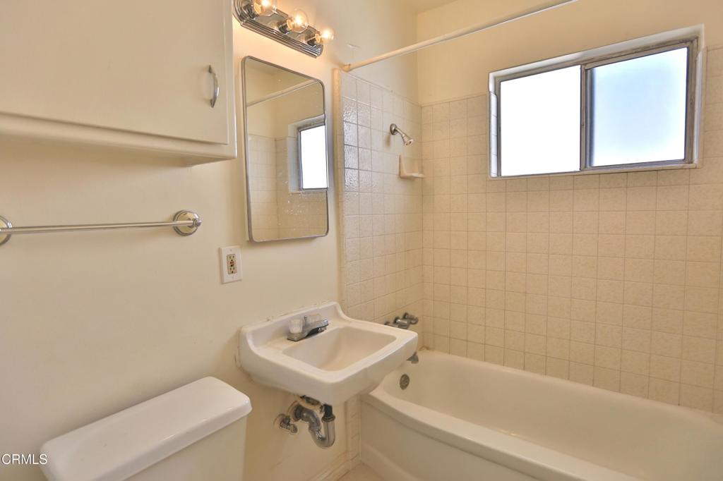 124 South Olive Avenue, Unit B Alhambra, CA 91801 - Photo 9 of 12 a bathroom with a sink a toilet and shower