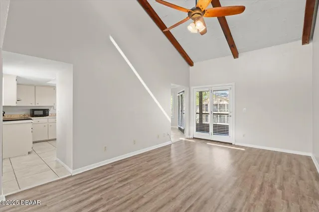 a view of an empty room with a window