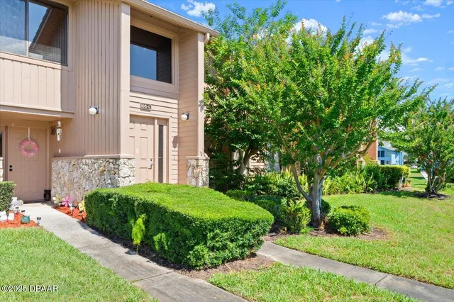 a view of a house with a garden