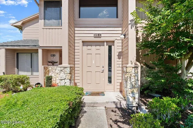 front view of a house with a small yard
