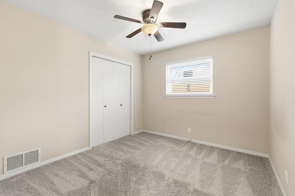 324 Moore Creek Road Hurst, TX 76053 - Photo 16 of 22 a view of an empty room with a window