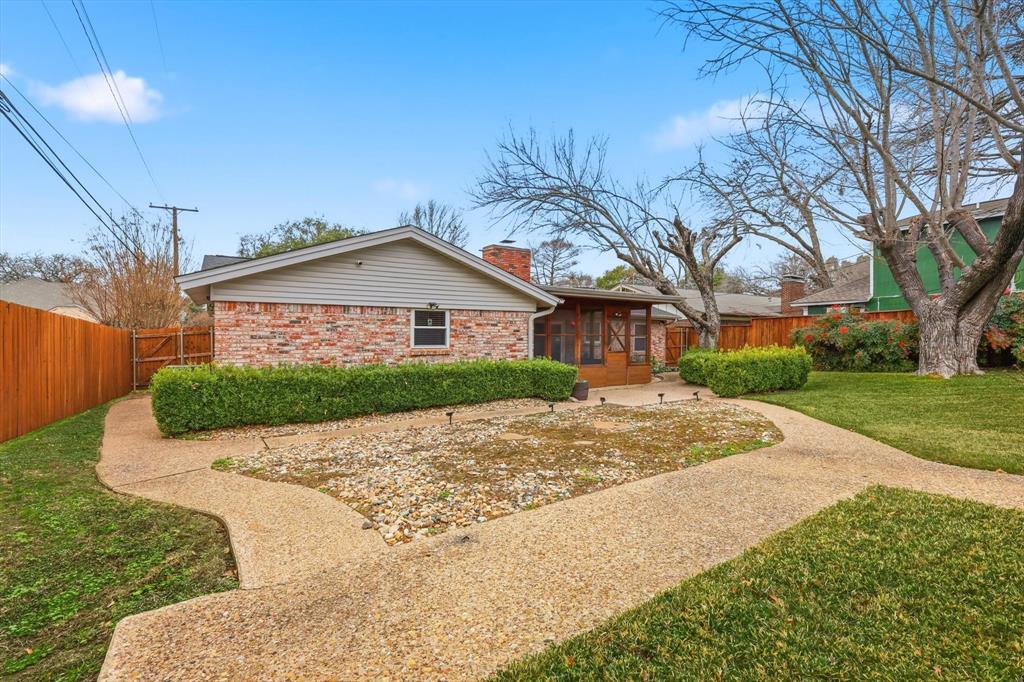 324 Moore Creek Road Hurst, TX 76053 - Photo 20 of 22 a front view of a house with a yard and garage