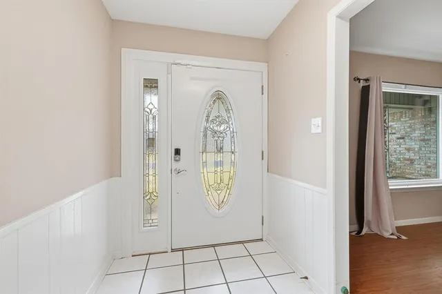 an entryway with a rug