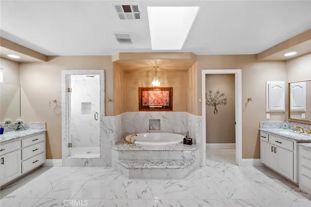 a living room with furniture and a ceiling fan