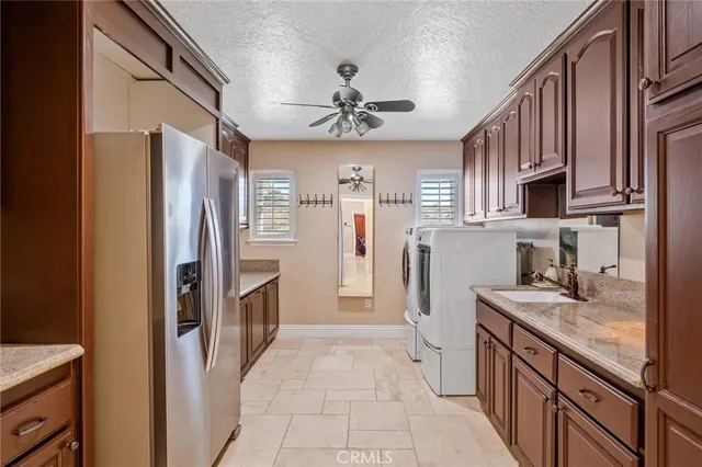 a kitchen with stainless steel appliances granite countertop a stove and a sink