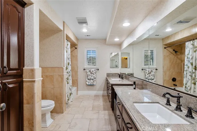 a dining room with furniture a rug and a large window