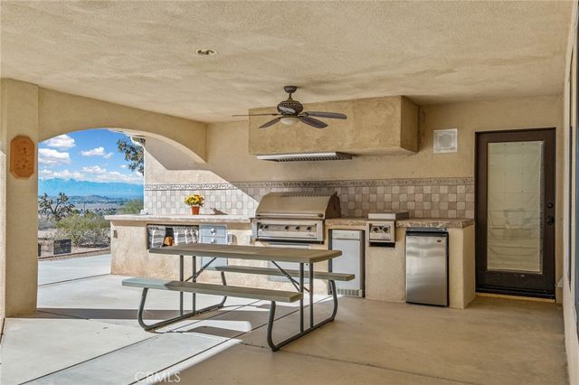 a view of a house with pool and trees