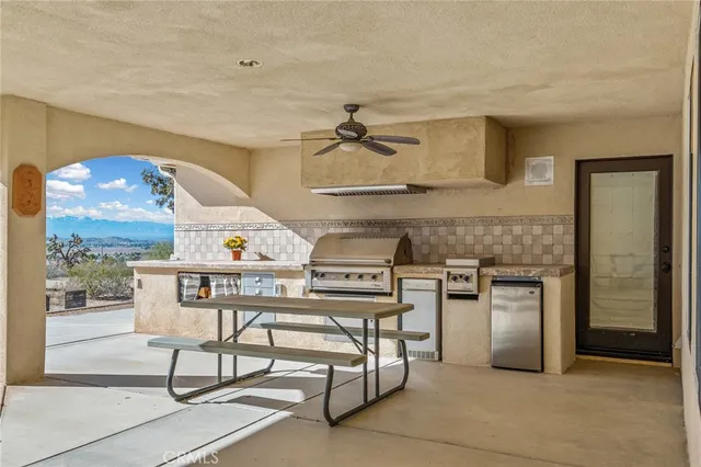 a view of a house with pool and trees