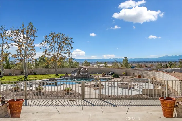 a view of a backyard with sitting area